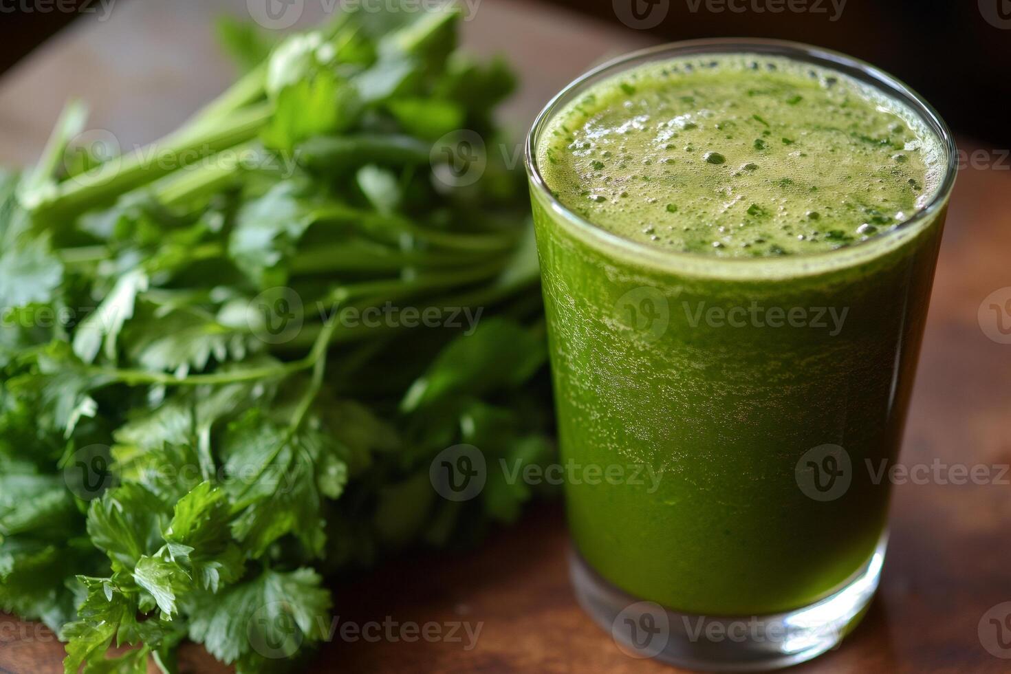 Fresh parsley being used to prepare healthy green juice photo