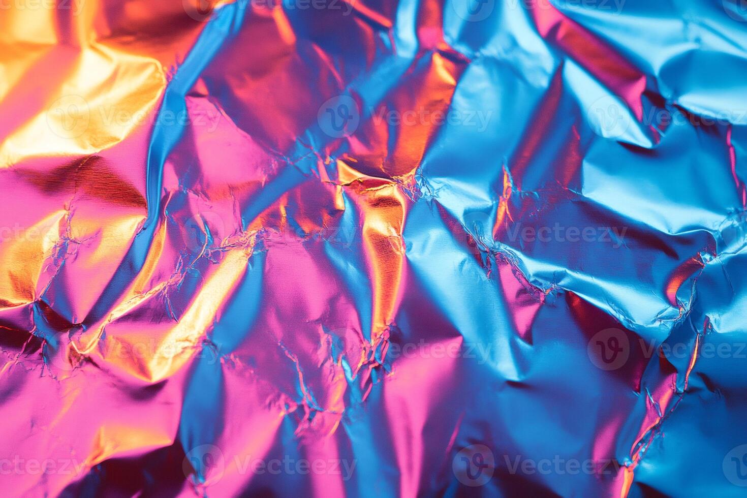Crumpled holographic foil creates vibrant abstract background texture photo