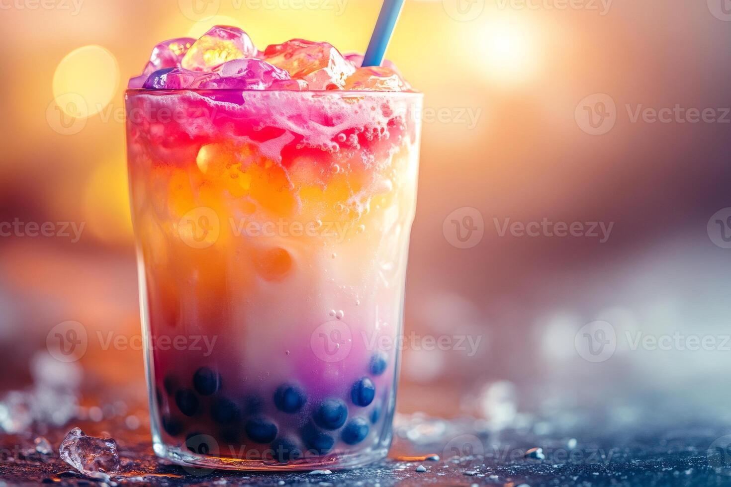 Refreshing bubble tea with ice cubes and colorful layers in a glass with blue straw photo