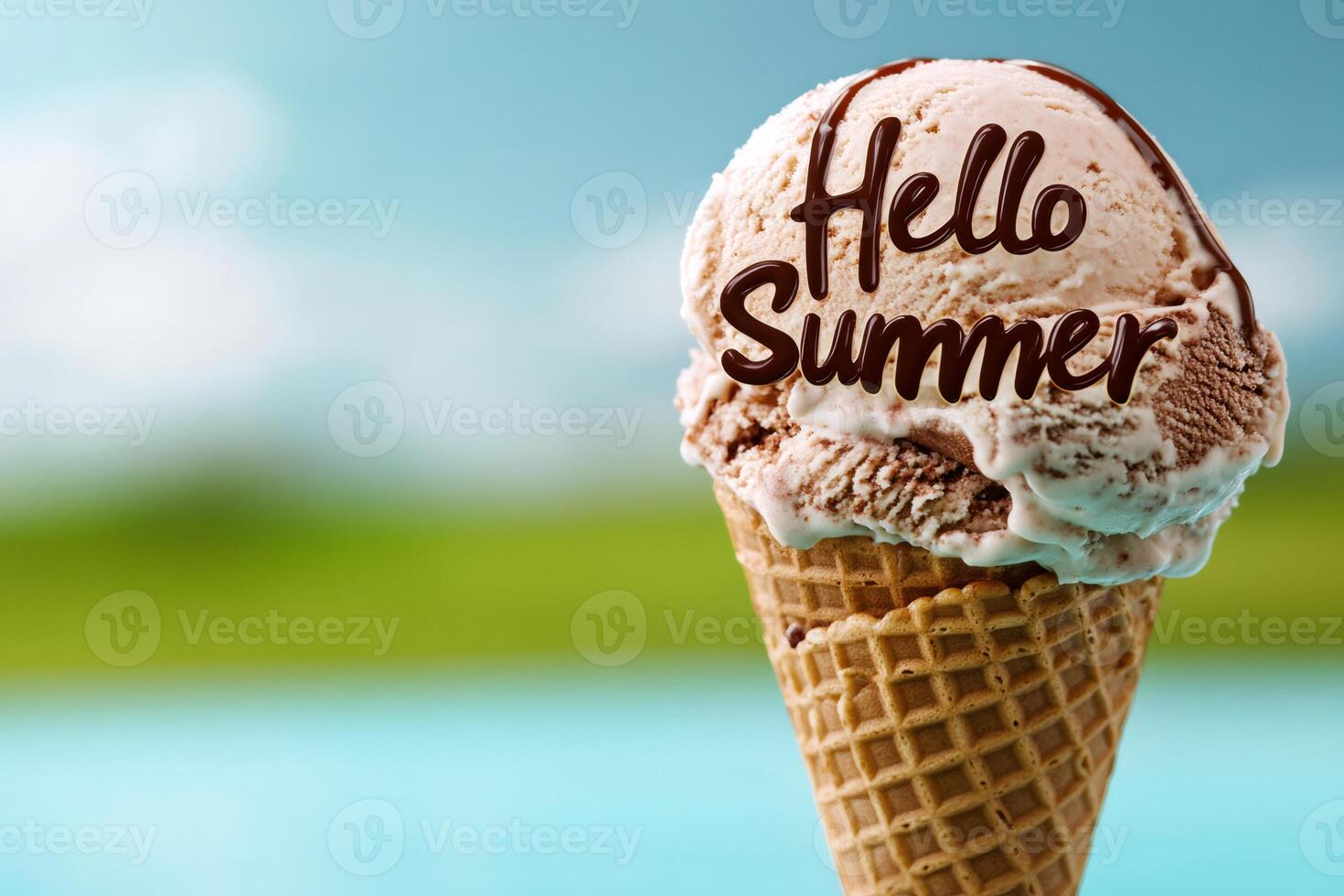 Ice cream cone announcing summer with chocolate writing on blurry background photo