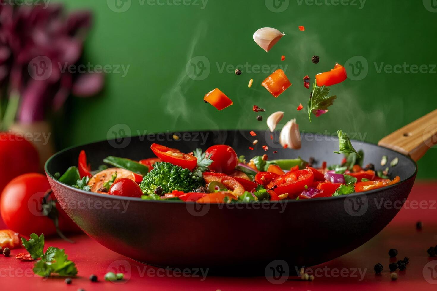 Fresh vegetables and spices falling into wok with steam cooking over colorful background photo