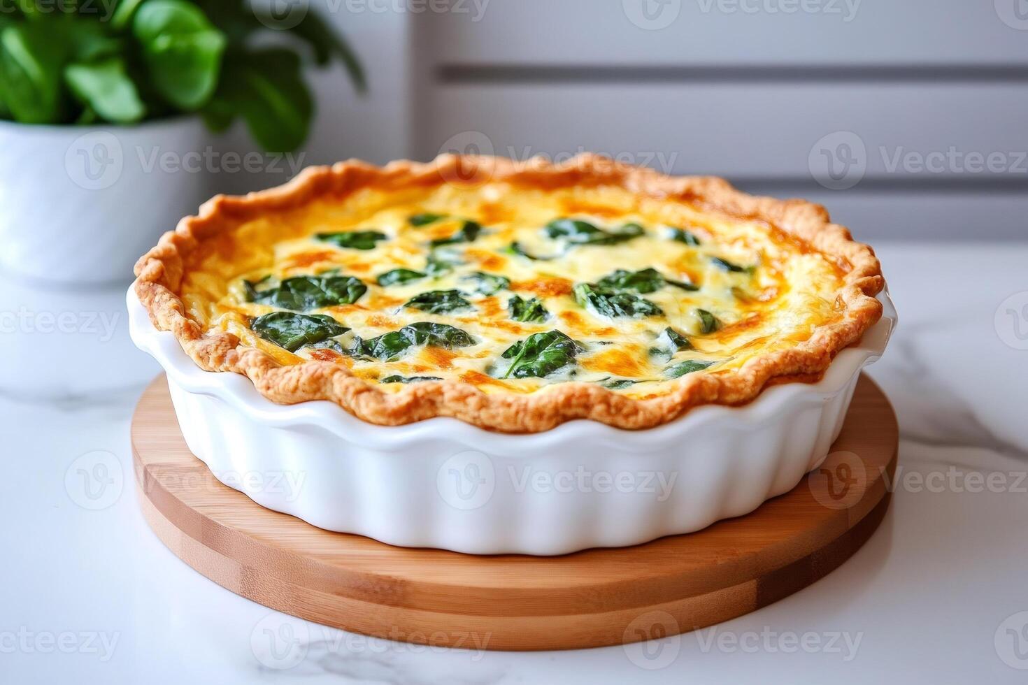 Delicious spinach quiche resting on a wooden tray in a modern kitchen photo