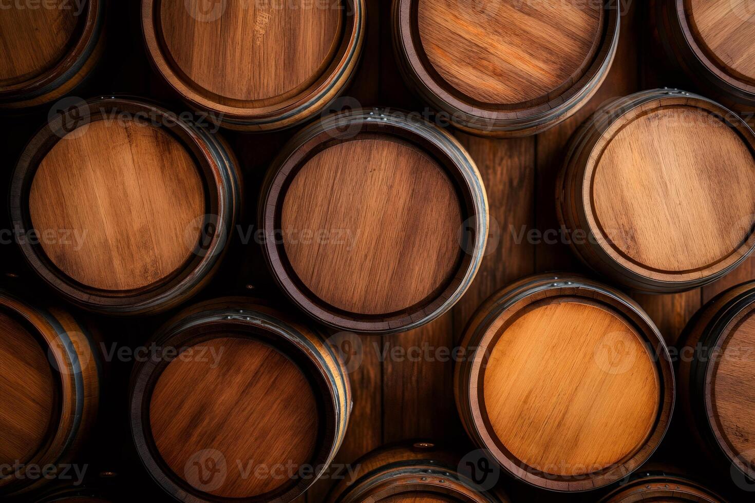 Wine cellar with stacked oak barrels showing aging process photo