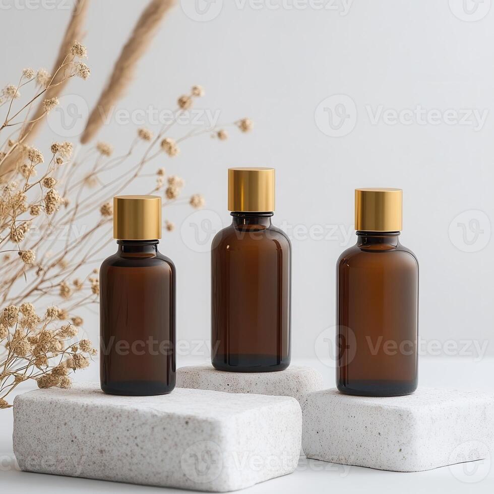 Three bottles of essential oils on a white surface photo