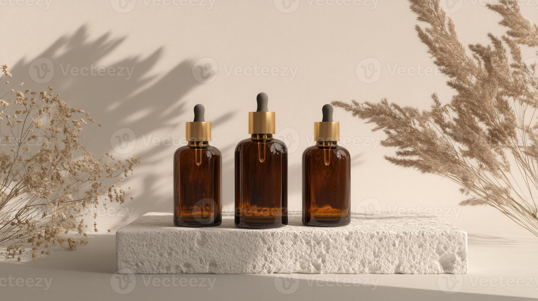 Three bottles of essential oil sit on a white block photo