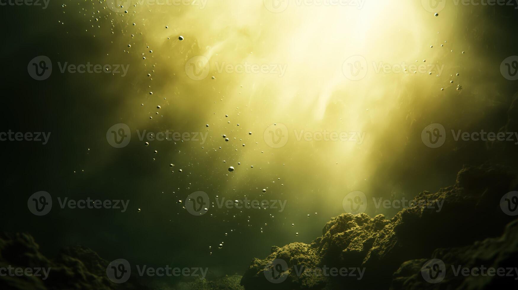 Underwater Light Rays Illuminating Suspended Particles and Dark Seabed photo