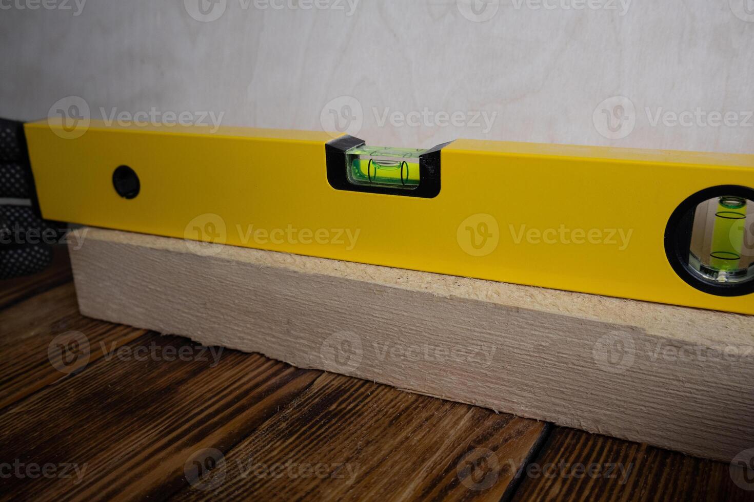 Spirit level on a piece of wood photo
