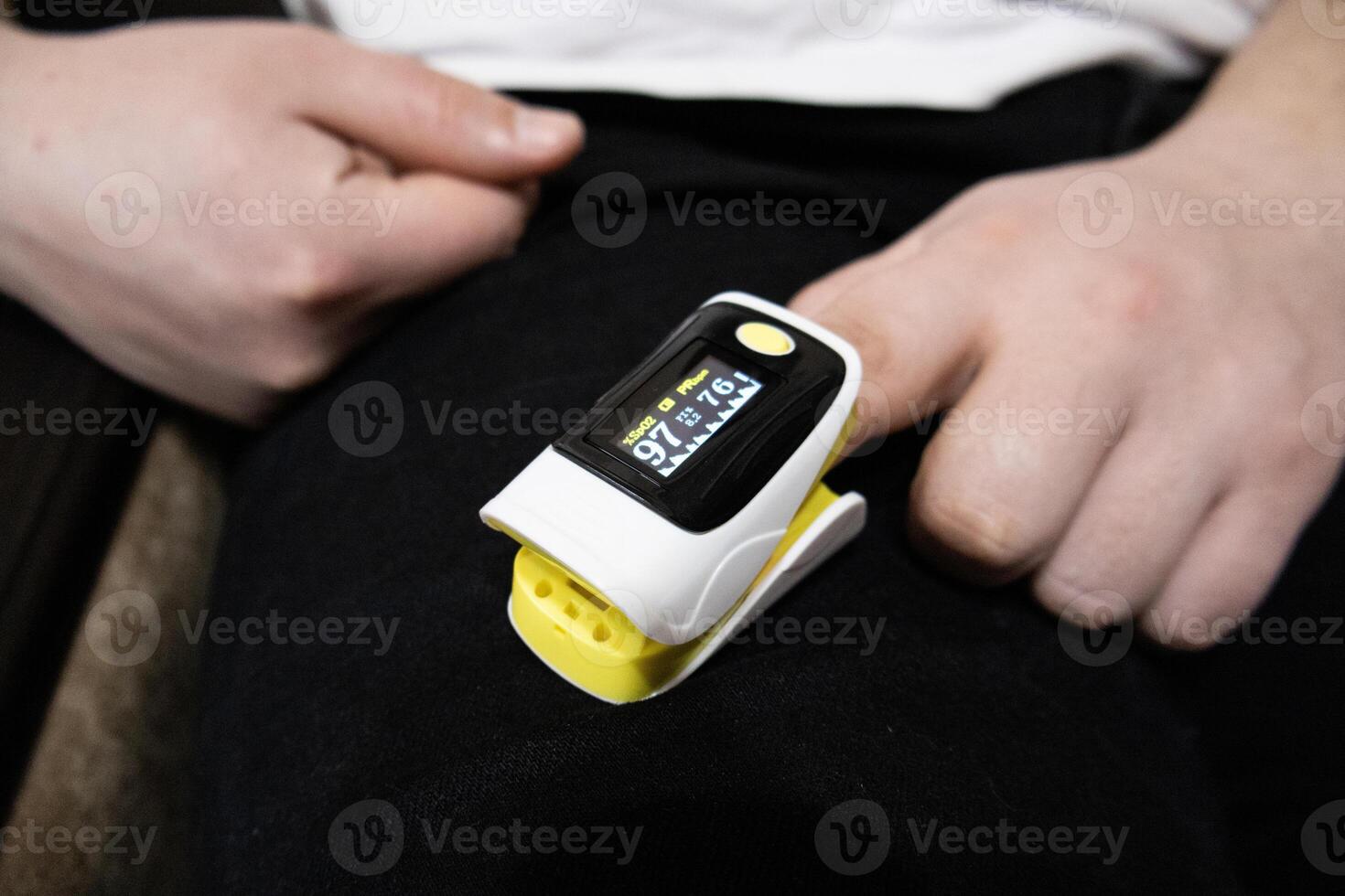 Pulse oximeter used to measure pulse rate and oxygen levels at home photo