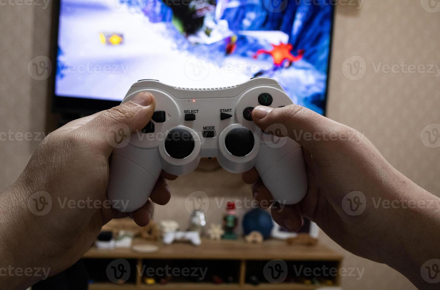 Playing game on console. Gaming game play on tv monitor. Gamer concept. Young boy hand with joystick photo