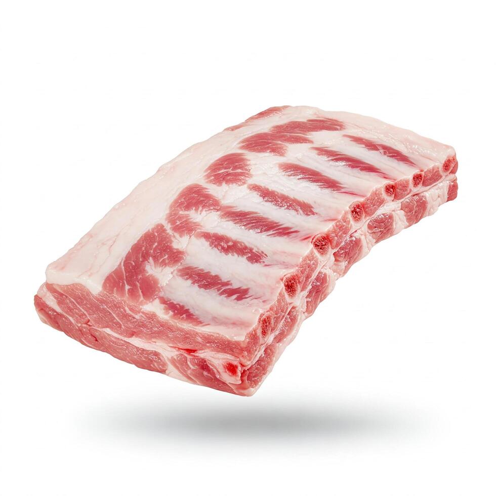 Fresh pork ribs on white background. Juicy meat with beautiful texture, ideal for advertising meat products and culinary projects. photo