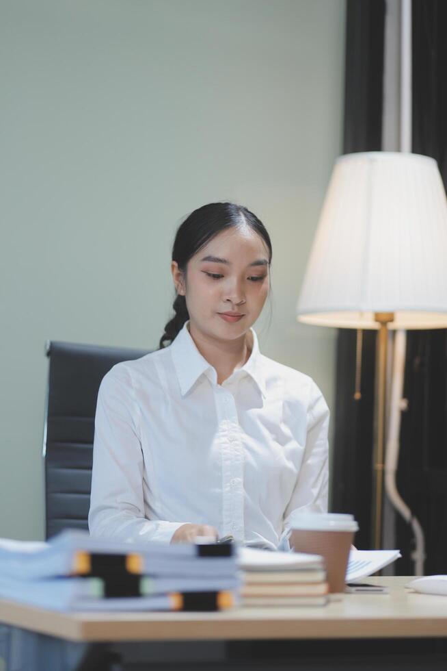 A woman sitting at a desk photo