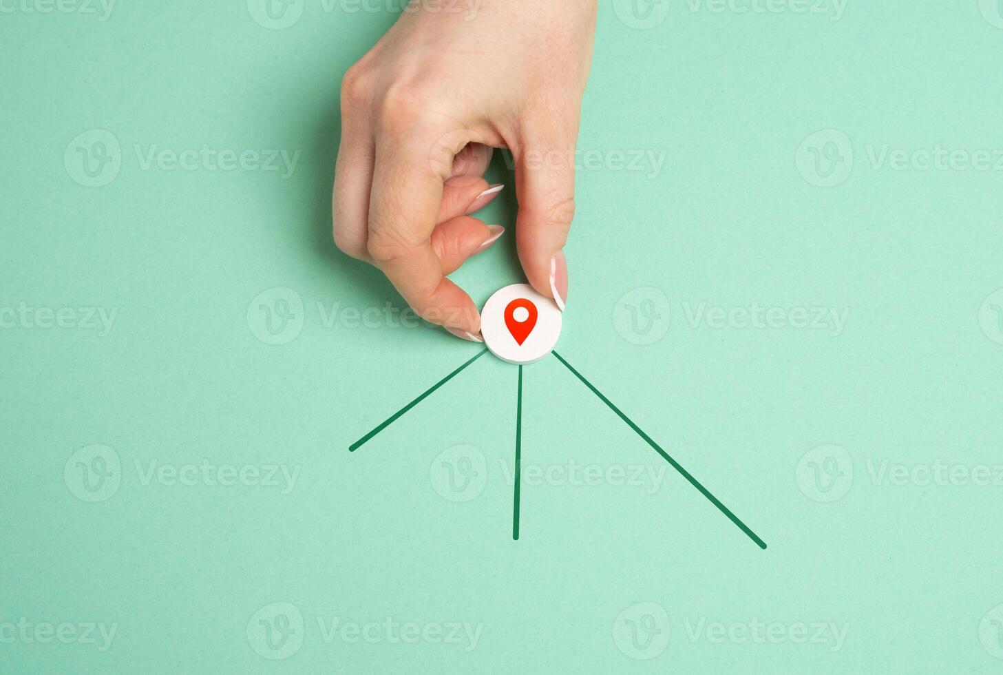 Hand with geolocation icon and new directions for next destinations. Navigation, exploring new destinations, planning travel routes. GPS services, mapping travel guidance photo