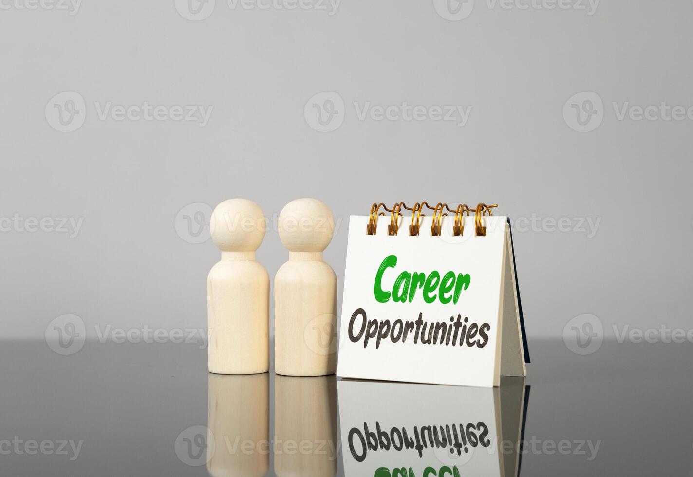 Career opportunities on a notebook and figures of people. New steps to advancement. Career plans photo