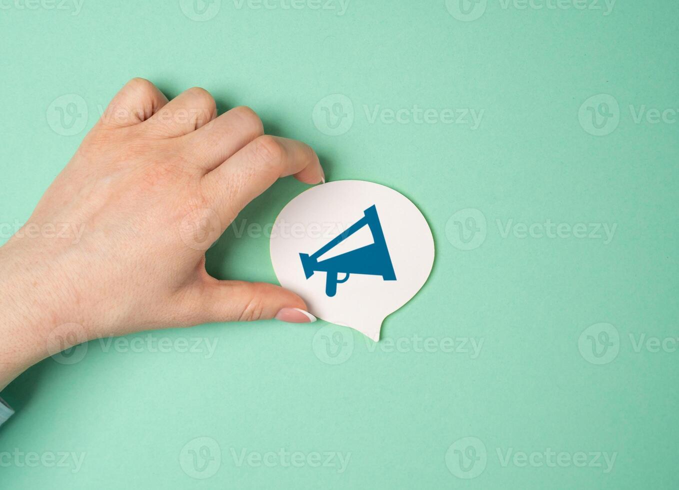 Woman holding speech bubble cloud with megaphone drawing. Loud announcement concept. Convey message to the public. Making important announcements. Marketing campaigns, activism, or communication photo