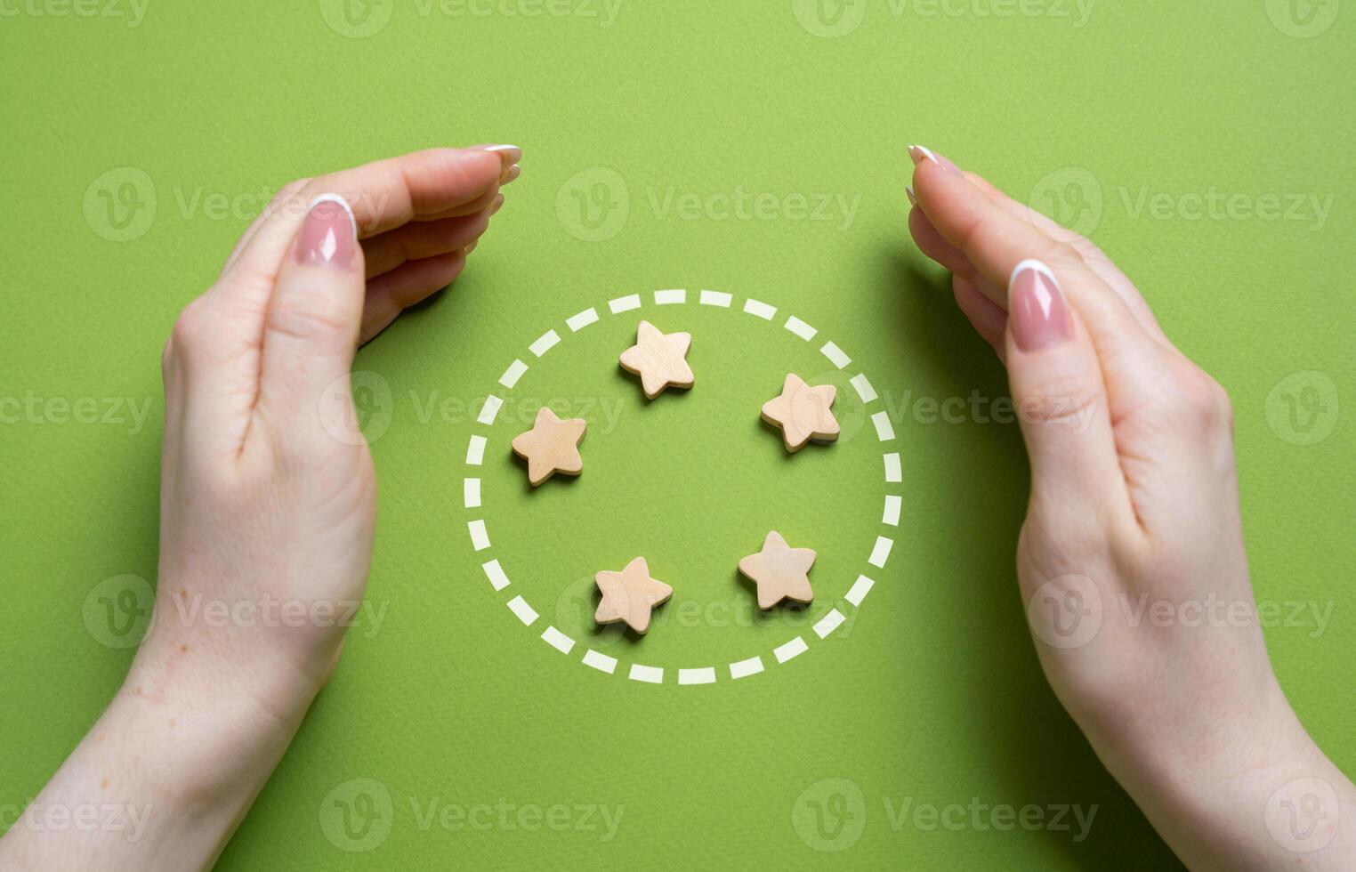 Hands guard the stars in the circle. Team members and organization members. Teamwork, unity, and organizational support. Collaboration, member protection, and collective responsibility photo