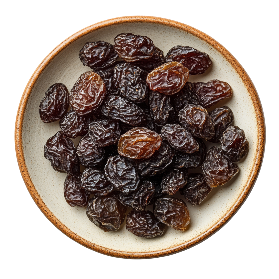 Dried raisins displayed in a round plate with a transparent background highlighting their natural texture, Dried raisins in a plate isolated on transparent background png