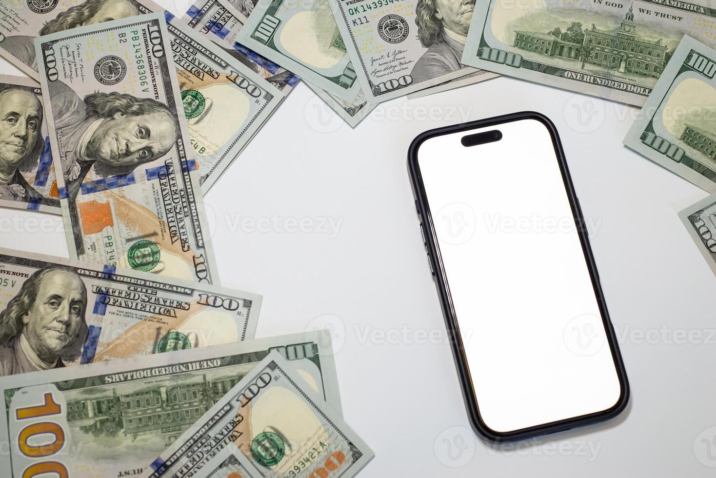 Currency spread around smartphone with white screen on white background, theme money, business, marketing, bank. Place for text photo