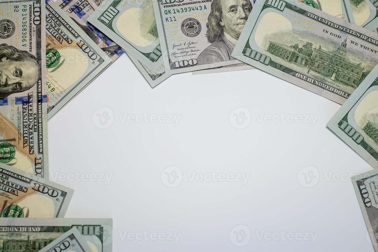 Stacks of hundred dollar bills arranged creatively on a flat surface for financial themes photo