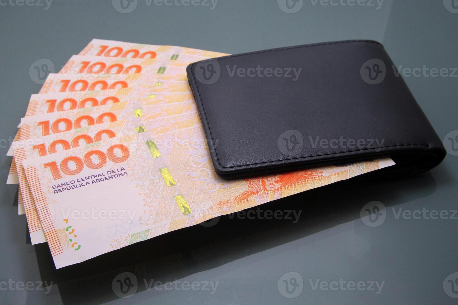 Argentine Pesos Banknotes Inside a Black Wallet, Thousand Pesos Bills photo