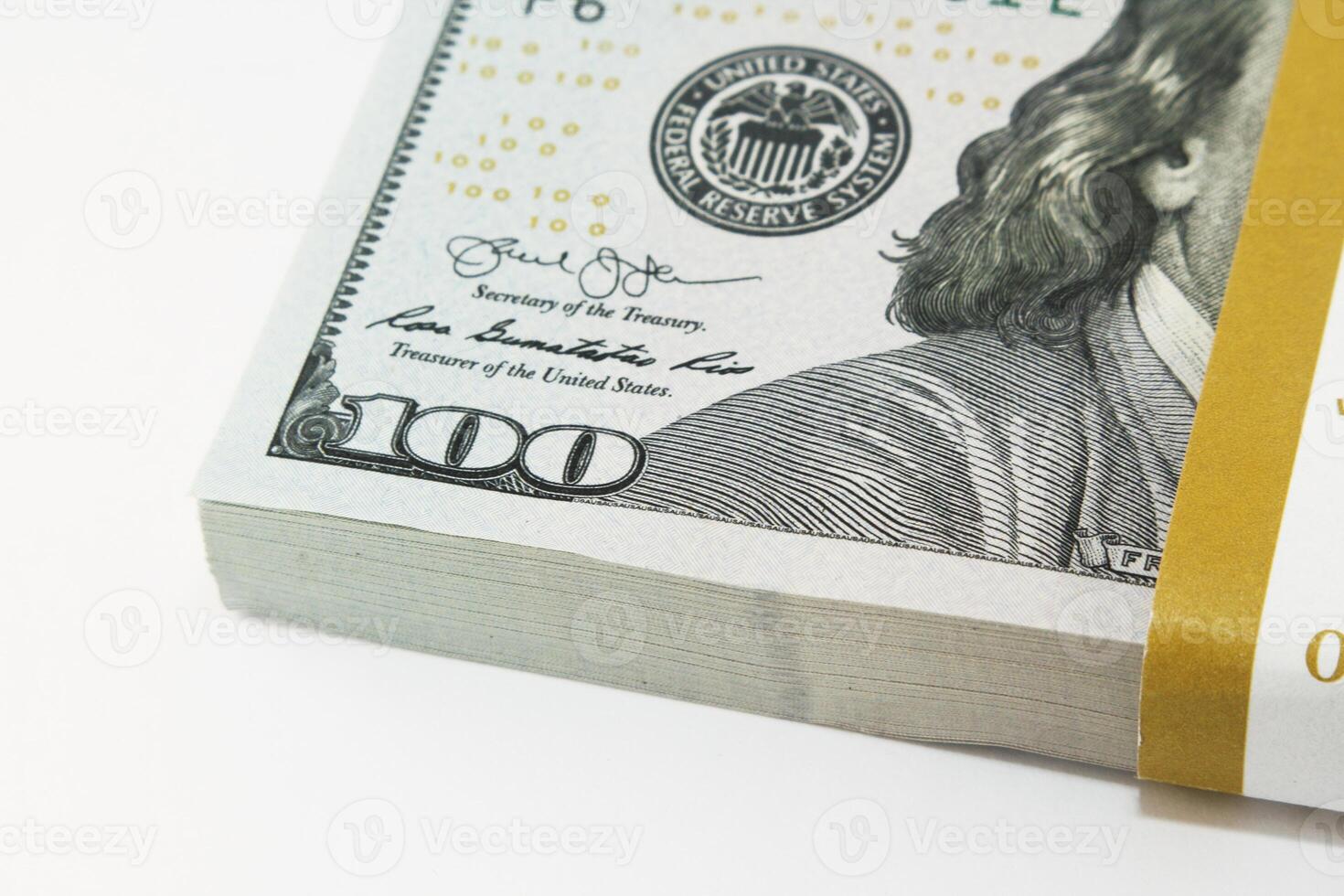 Close-up of stacked American hundred dollar bills photo