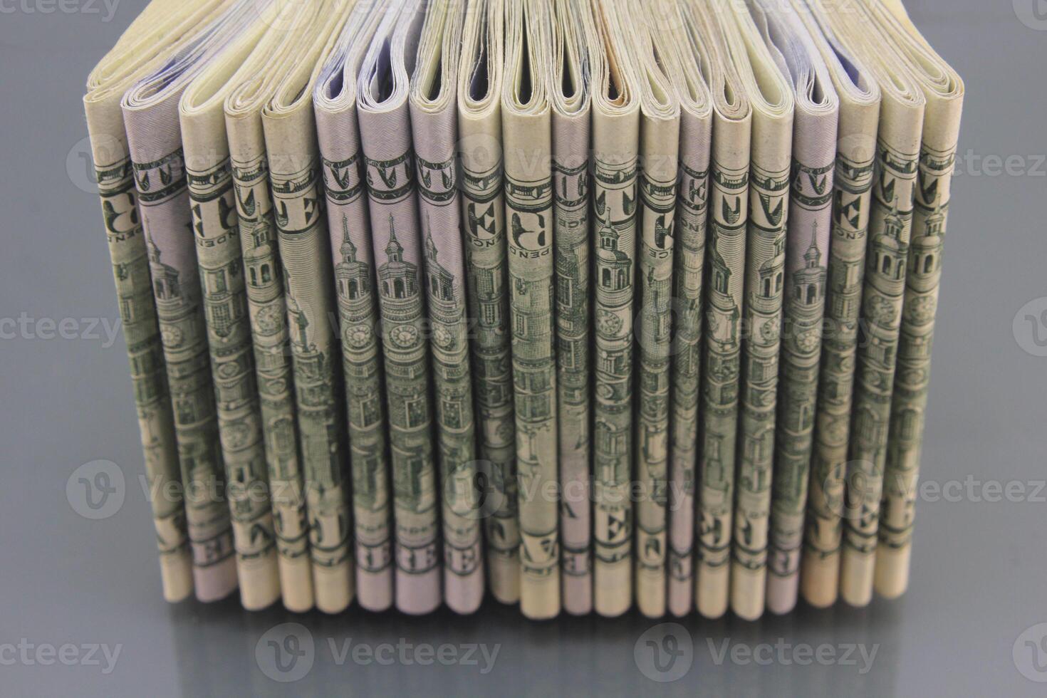 Stacks of American money, hundred dollar bills in cash on a dark background, many hundred dollar bills photo