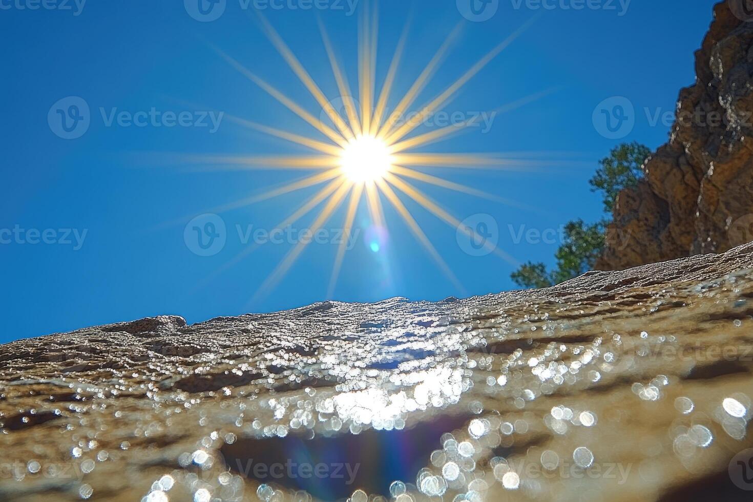 Sunbeams Reflected in Water and Rocks photo