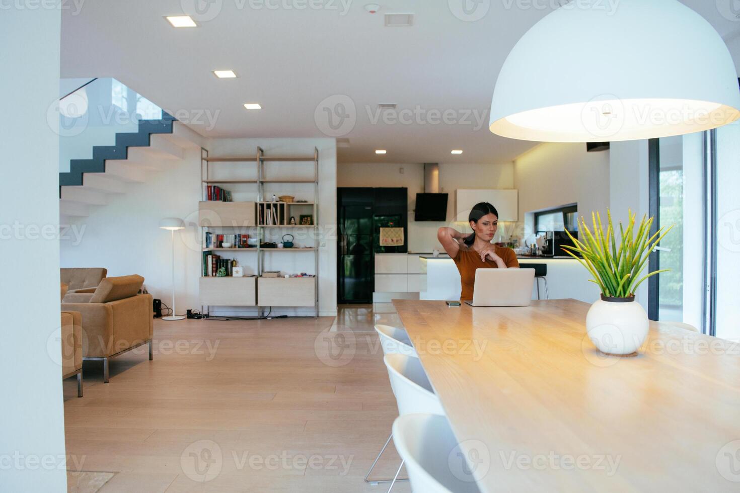 Woman sitting in living room using laptop looking at cam talk by call with business friend relatives, head shot. Job interview answering questions photo