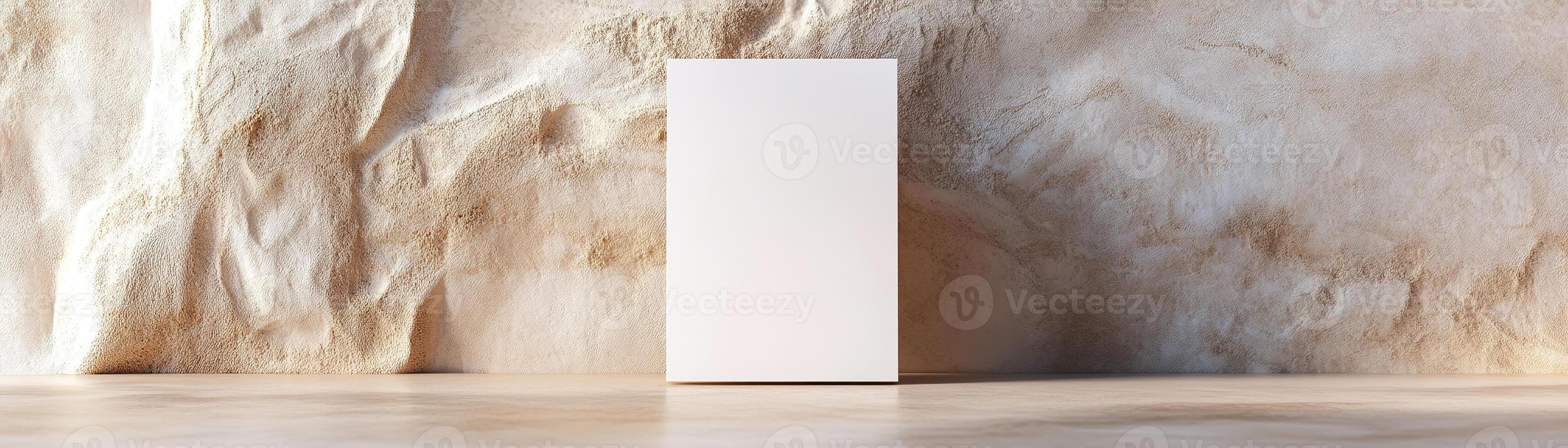 A blank business card stands upright and slightly leans against a neutral-toned wall. The soft focus enhances the aesthetic, creating a professional ambiance ideal for luxury branding photo