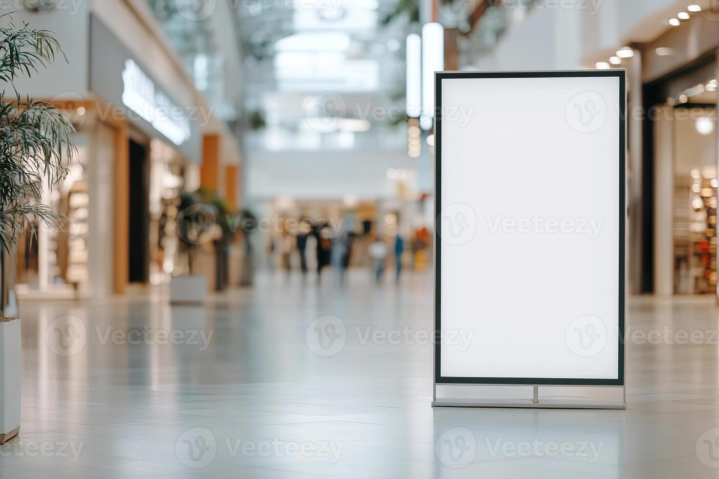 Blank vertical billboard stands prominently in a well-lit shopping mall. Surrounded by stylish shops, this space is perfect for retail and lifestyle promotions, attracting shopper attention photo