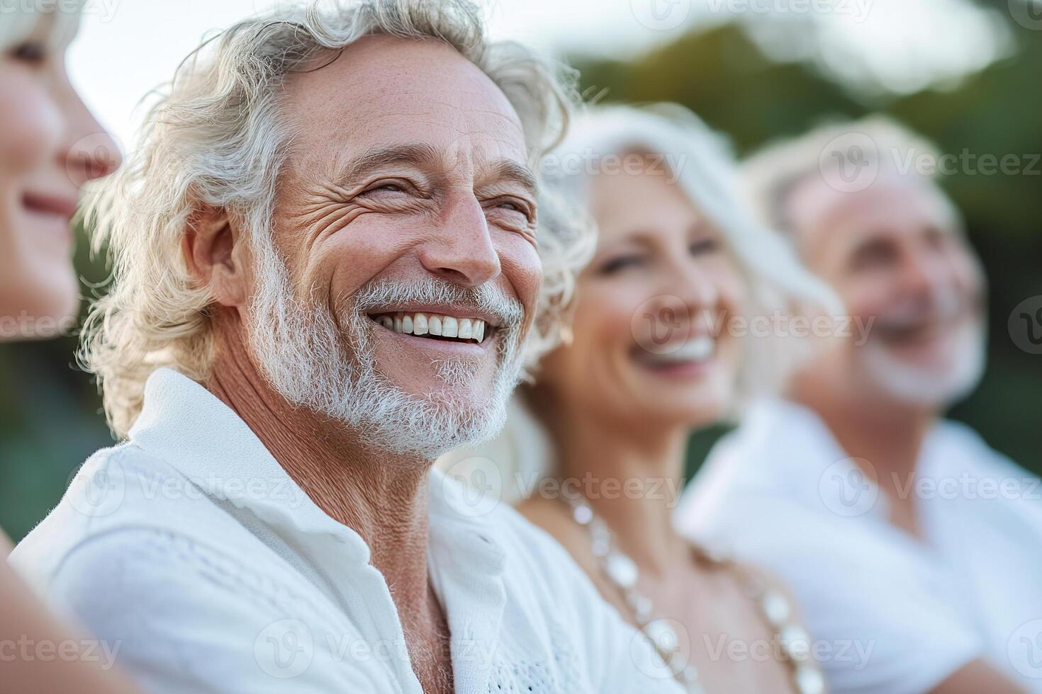 A cheerful group of seniors share joyful laughter in a lively outdoor park, immersed in connection and friendship during a sunny afternoon. Their smiles reflect a moment of happiness and community photo
