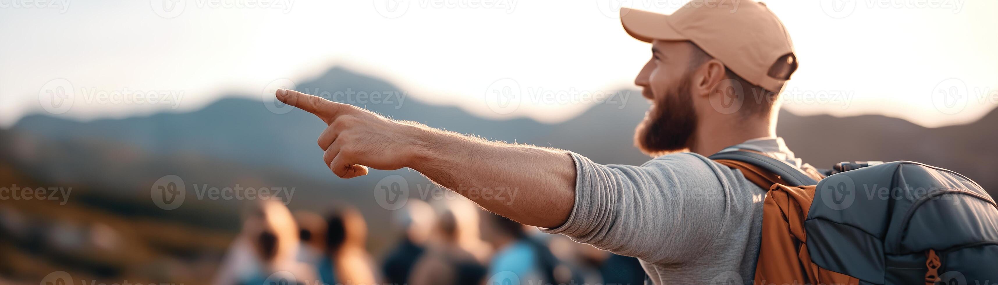 A charismatic travel guide in casual outdoor attire points towards a stunning mountain landmark while leading an enthusiastic group of tourists. The inviting atmosphere promotes adventure photo