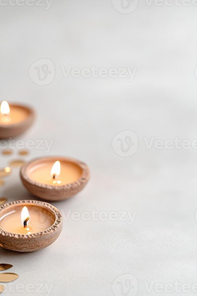 Bottom border adorned with traditional Diwali diyas casting a warm light, complemented by intricate Rangoli patterns on a subtly neutral backdrop, ideal for festive themes photo