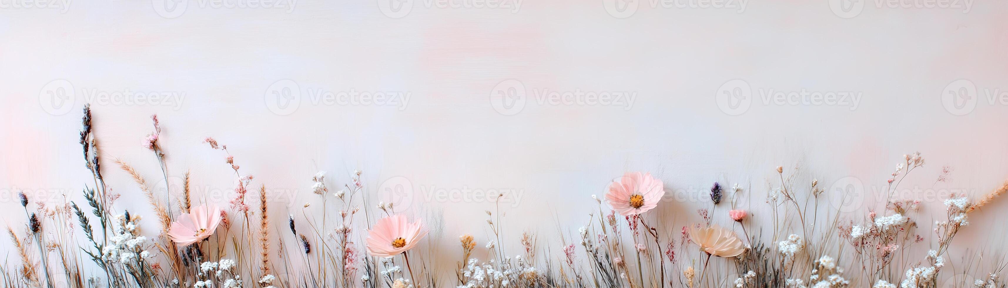 A rustic strip of wild meadow grass features delicate wildflowers against a softly blurred pastel backdrop. Ideal for floral designs and eco-conscious branding with a whimsical touch photo