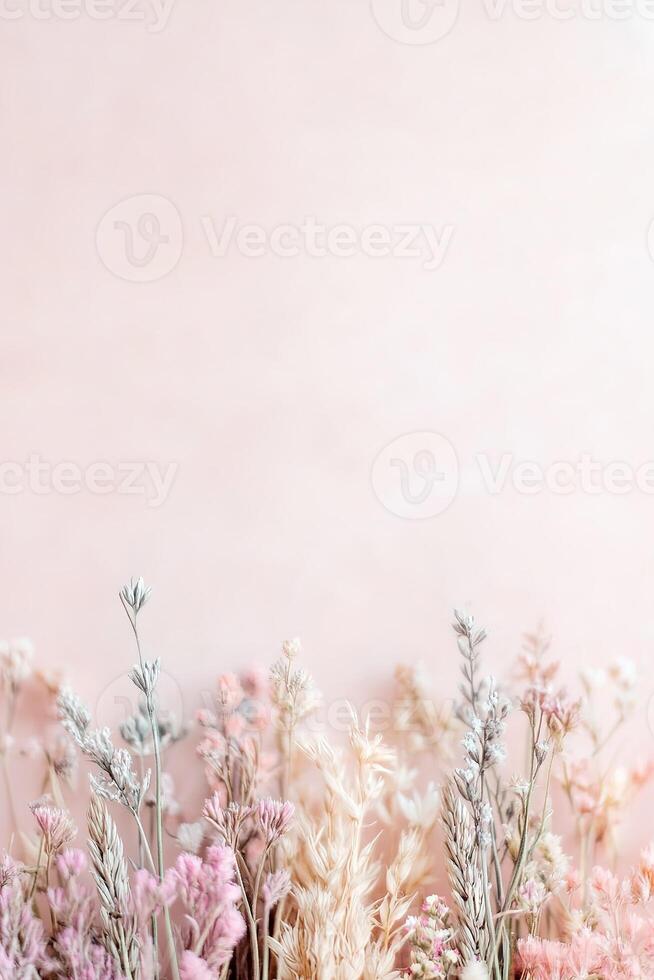 A rustic strip of wild meadow grass features tiny colorful wildflowers scattered throughout, set against a soft pastel background. Perfect for floral and eco-conscious designs photo