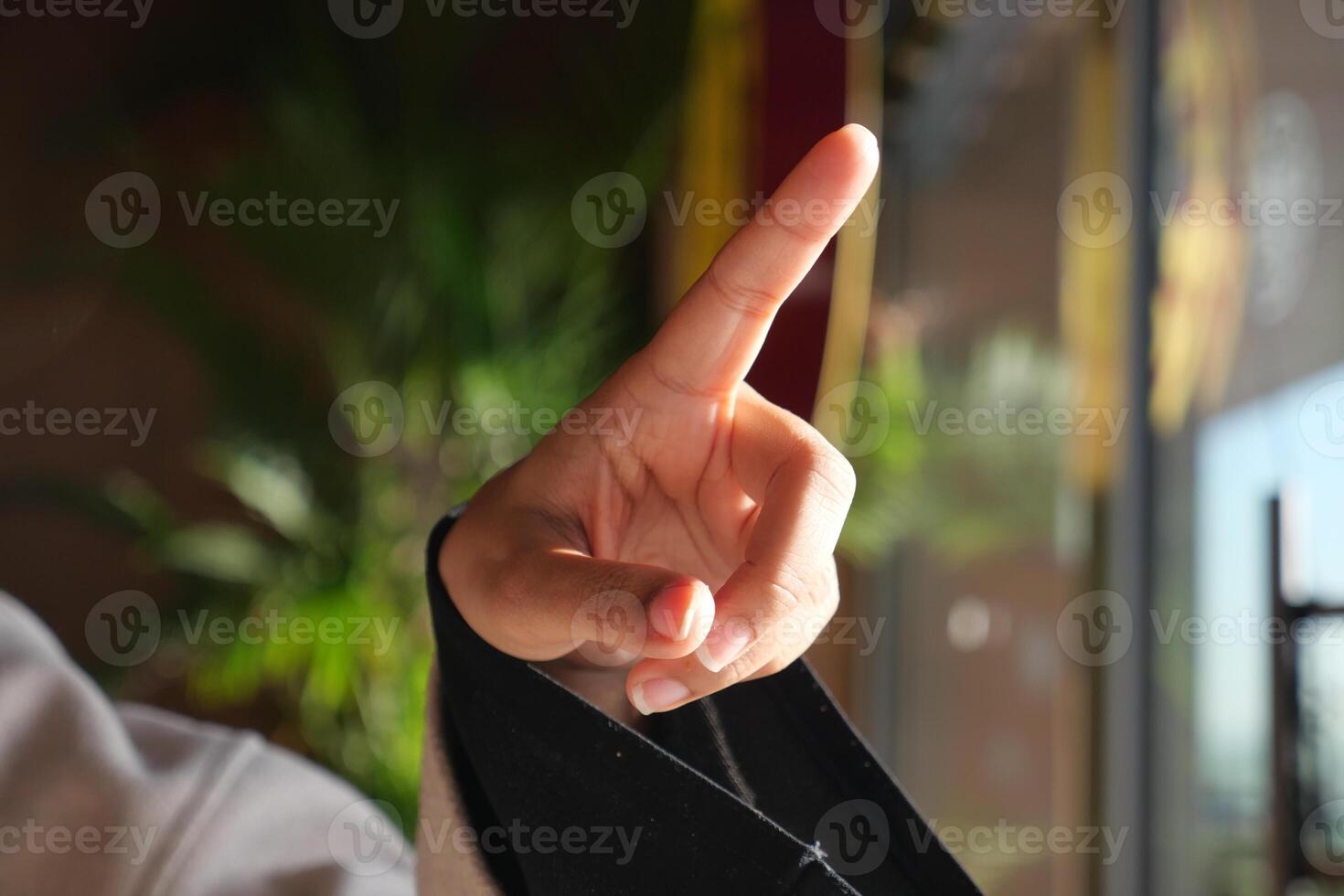 Hand raised in a gesture of communication during a conversation photo