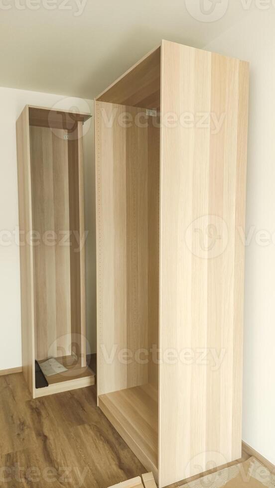 Assembling wooden wardrobe in modern apartment in prague photo