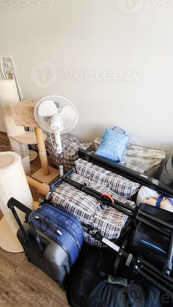 Luggage and belongings ready for a move in prague apartment photo
