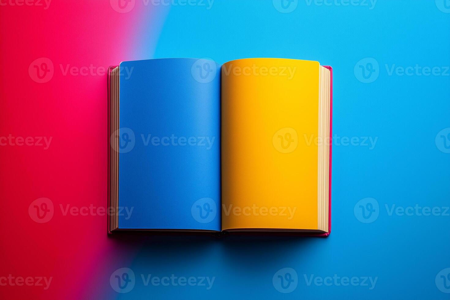 Open book displaying vivid blue, yellow pages sprawling across pink, blue background Knowledge Day copy space mockup photo