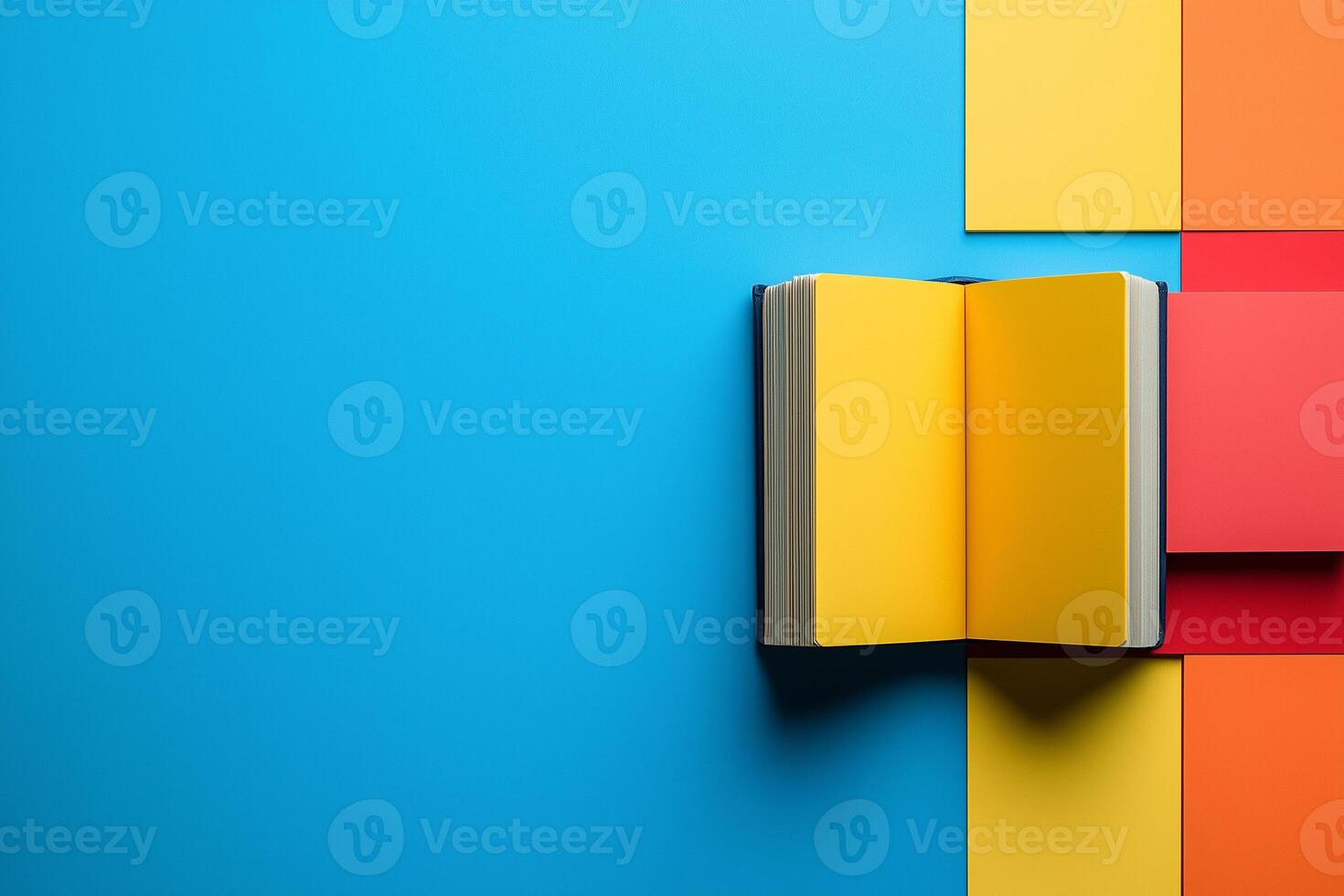 Yellow paged book resting on geometric surface, symbolizing reading passion during World Knowledge Day copy space mockup photo
