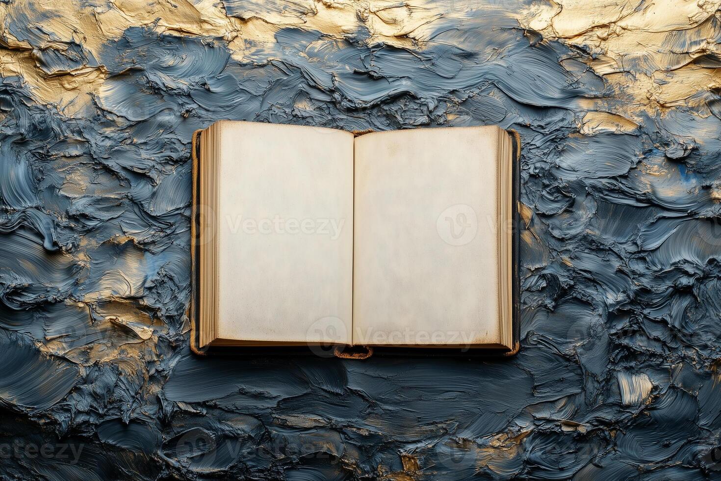 Open book displaying blank pages against textured blue gold surface, World Knowledge Day copy space mockup photo