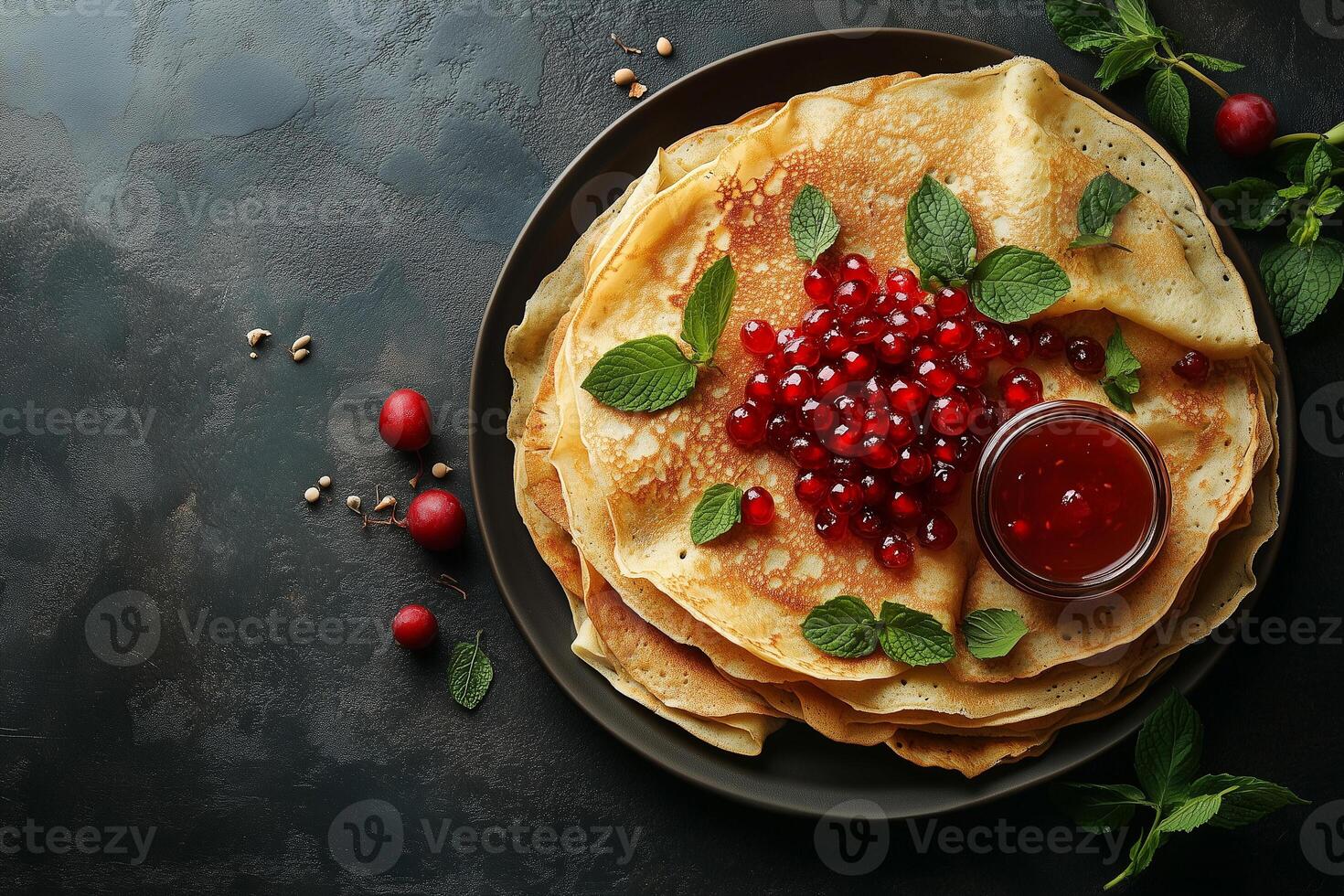 Delicate pancake stack featuring vibrant red currants, fresh mint, accompanied by small jelly jar, highlighting traditional festive breakfast top view photo