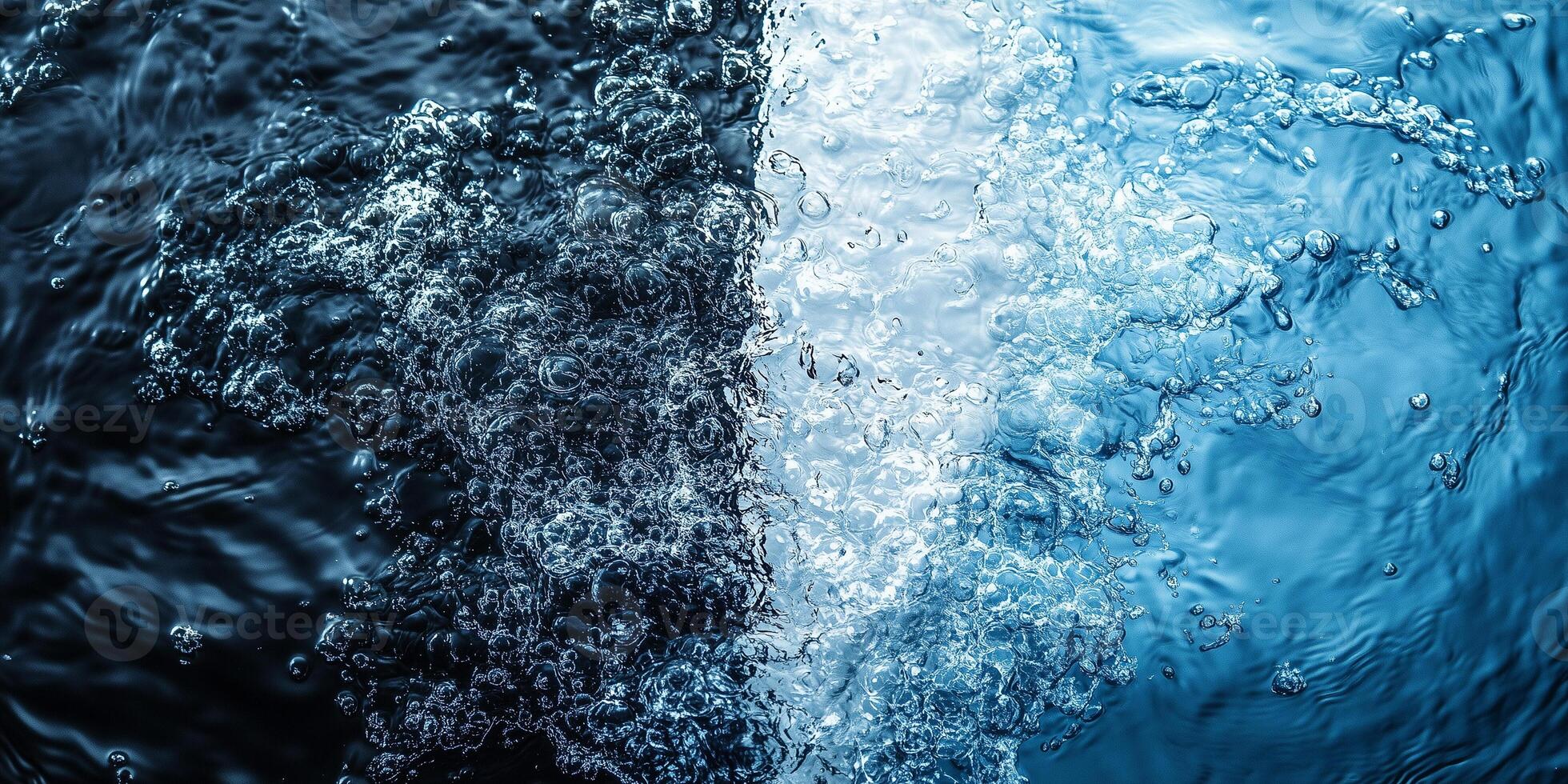 Oxygen bubbles ascending through deep blue waters, forming dynamic contrast between dark and illuminated sections photo