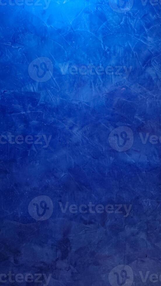 Deep blue textured background creating a moody atmosphere photo