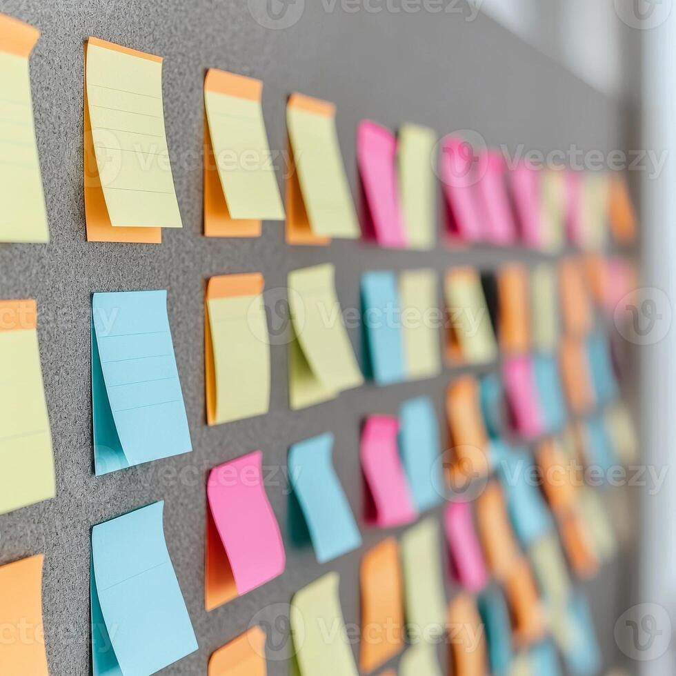 Project management coordination concept. Colorful sticky notes arranged on a gray board for organization and brainstorming tasks. photo