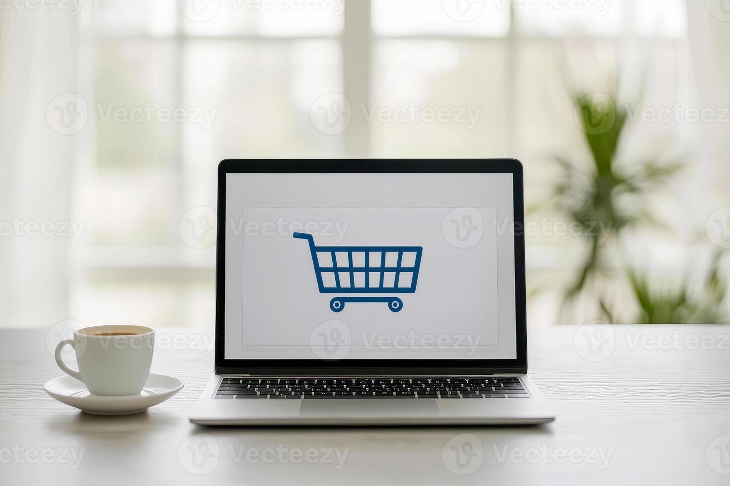 e-commerce checkout process concept Laptop displaying a shopping cart icon beside a coffee cup in a bright, modern setting. photo