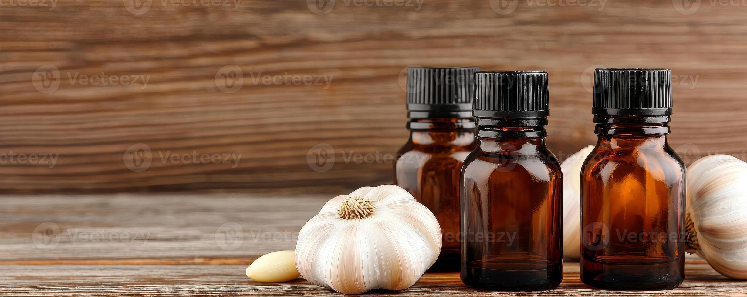 Garlic medicine and herbal remedy concept. Brown glass bottles with garlic cloves on a wooden surface, suggesting natural remedies or essential oils. photo