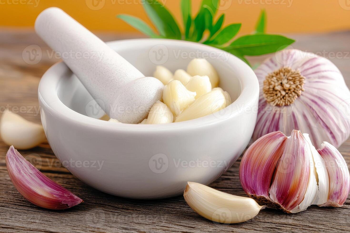 Garlic medicine and herbal remedy concept. Mortar and pestle with garlic cloves on a wooden surface, enhancing culinary visuals. photo
