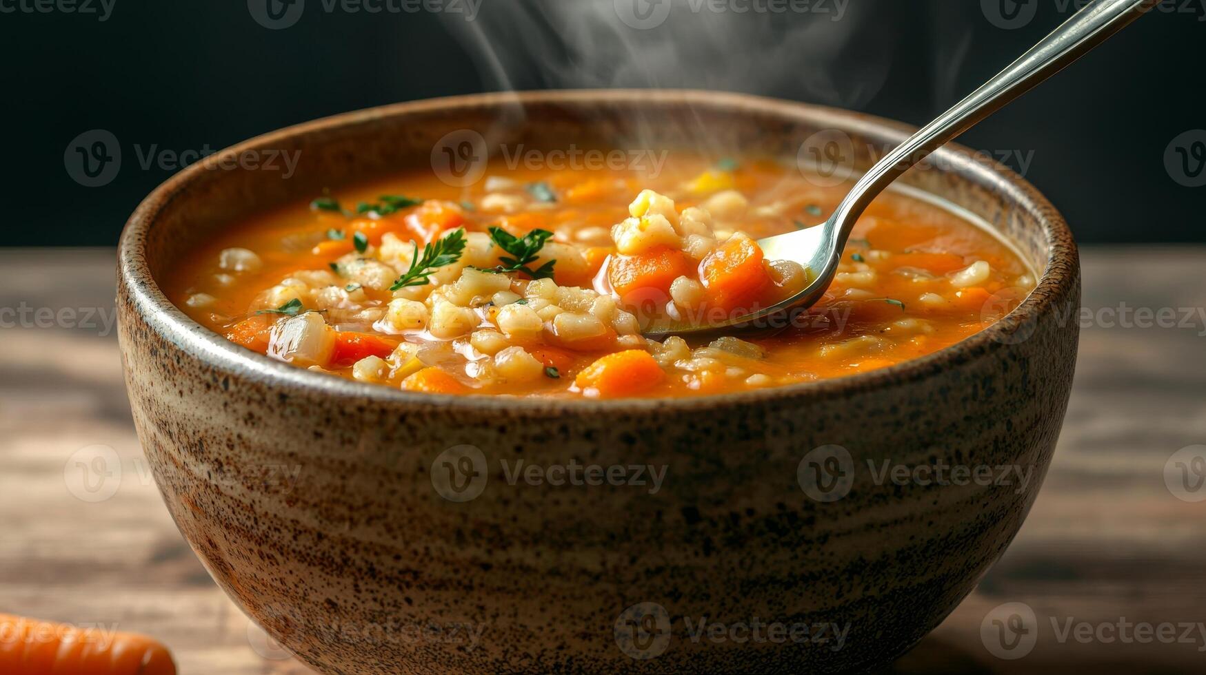Carrot soup in ceramic bowl concept. Warm, hearty vegetable soup in a rustic bowl with steam rising. photo