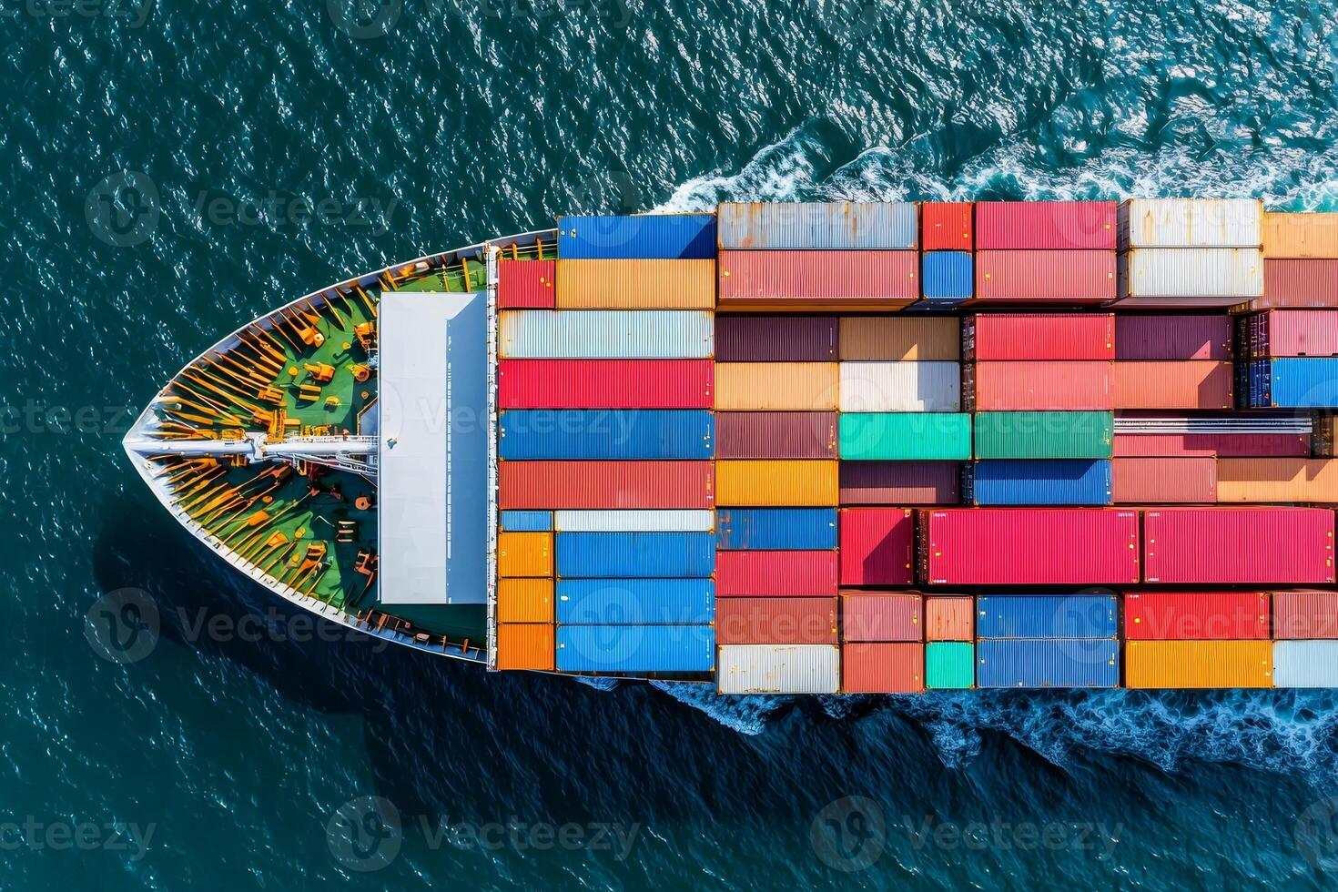 Aerial view of a cargo ship loaded with colorful containers sailing through deep blue waters. photo