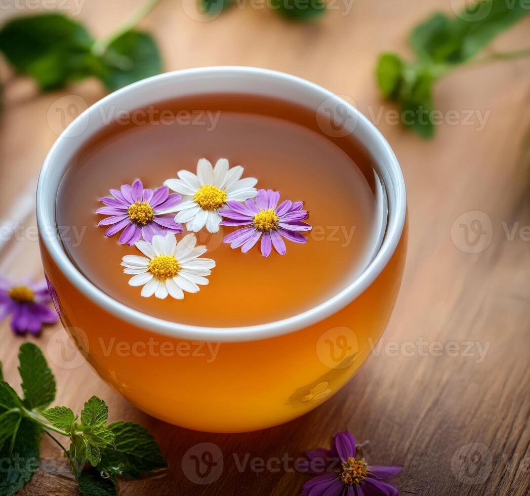 Lifestyle wellness with mental health and self-care concept. Tea with flowers floating, surrounded by greenery. photo
